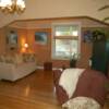 Craftsman style living room showing earthtone plaster walls and paler tinted archway