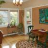 Cratsman style dinning room with earthtone tinted plaster and paler tinted plaster above picture rail.